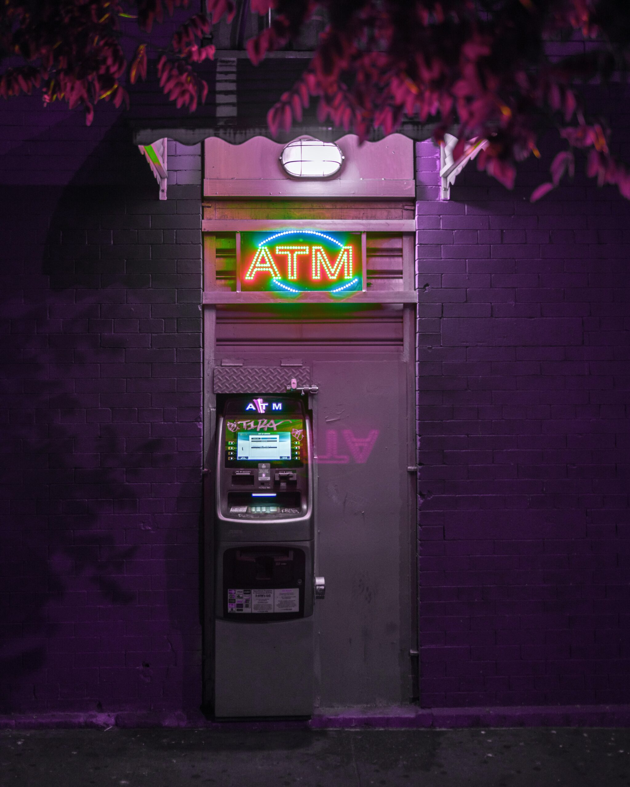 Neon lit ATM on the street